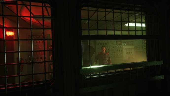 Still Wakes the Deep official screenshot showing a person lookingtowards you from the other side of a window inside a dimly lit oil rig